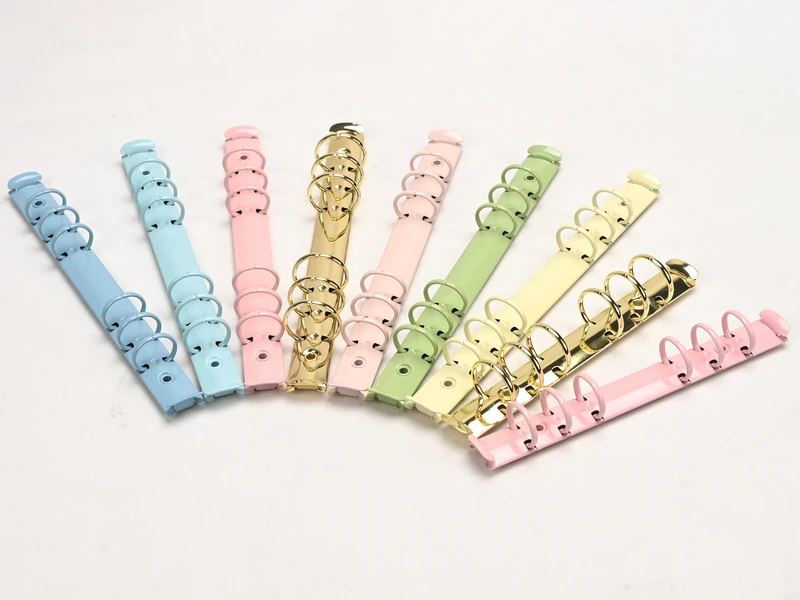 Colored ring binder mechanisms